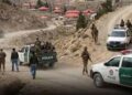 Security personnel inspect the area after six abducted labourers were found shot dead in Turbat, Balochistan.