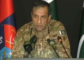 DG ISPR Lieutenant General Ahmed Sharif Chaudhry prepares to brief the media on Pakistan's security situation and counterterrorism operations.