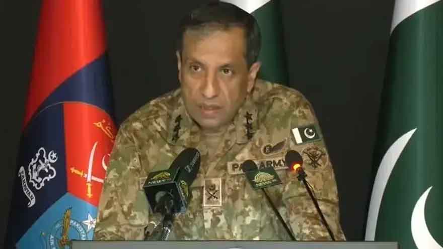 DG ISPR Lieutenant General Ahmed Sharif Chaudhry prepares to brief the media on Pakistan's security situation and counterterrorism operations.