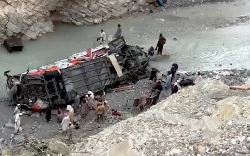 Emergency responders conduct rescue operations at the site of a deadly passenger coach crash in Balochistan's Dana Sar area.