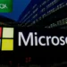 Microsoft logo displayed outside company headquarters following the announcement of Xbox restructuring and workforce reductions.