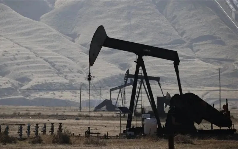 Oil storage tanks and tanker ships representing global crude markets as Brent and WTI prices edge higher.