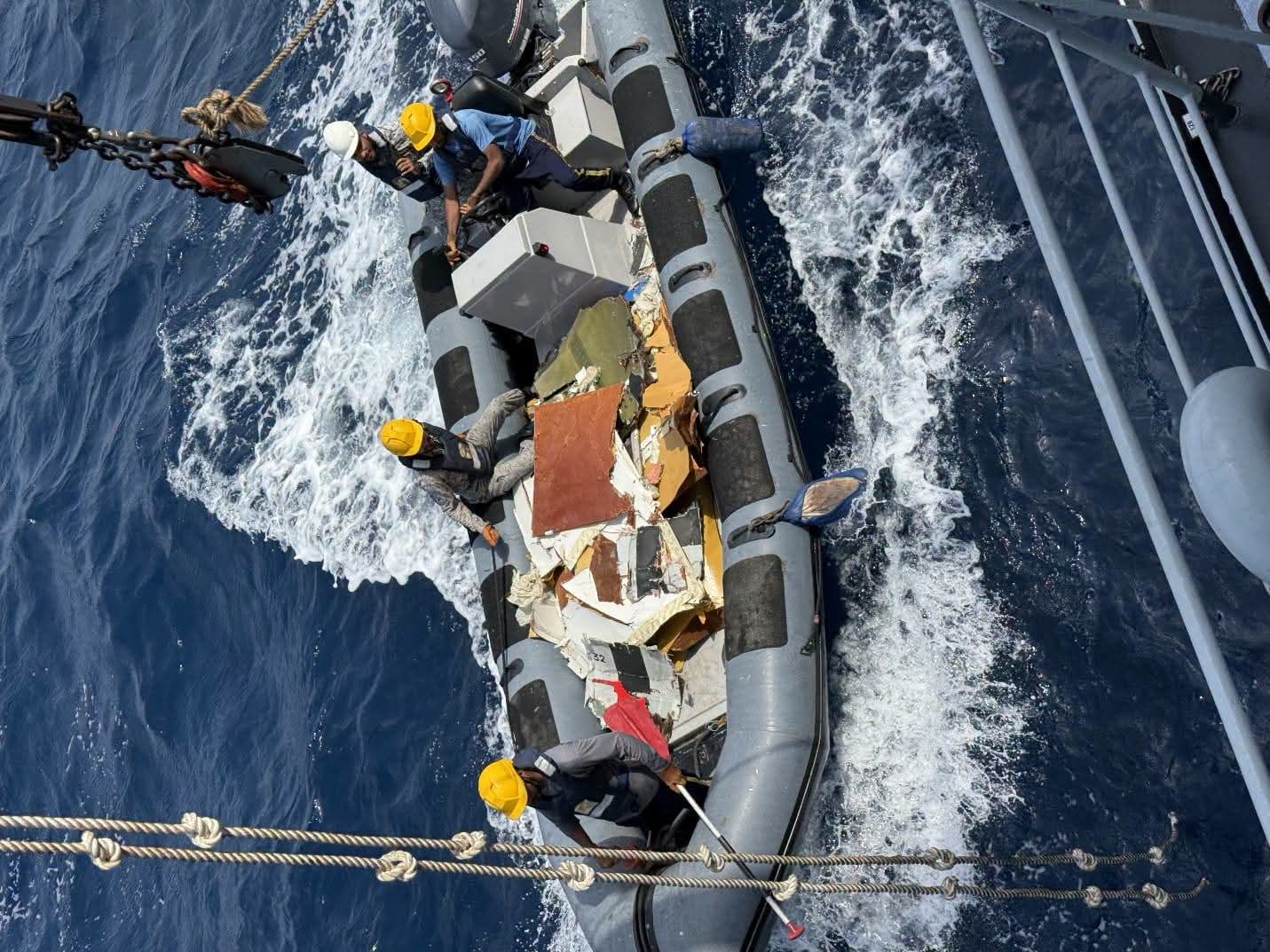 Pakistan Navy vessels conduct search and recovery operations near the wreckage of a K2 Airways cargo plane off the coast of Ormara.