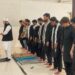 Participants from Shia and Sunni communities offer Zuhrain prayers together during the Youm-e-Hussain event at Federal Urdu University in Karachi.