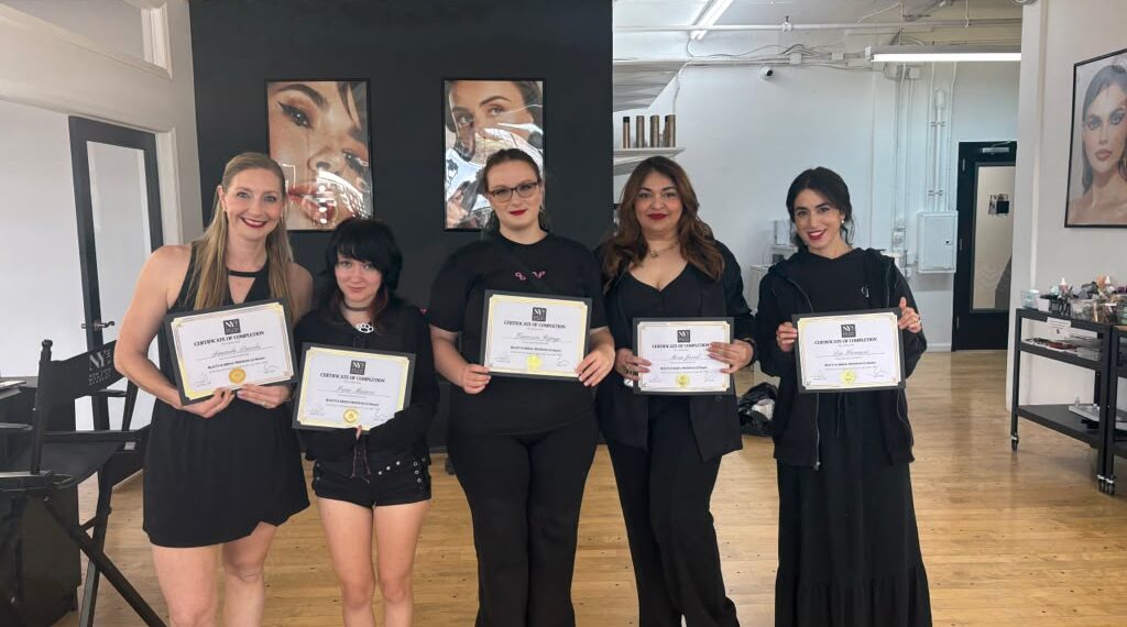 Makeup artist Mona J presenting a New York-inspired Hollywood glam makeup style with smoky eyes and contoured features.