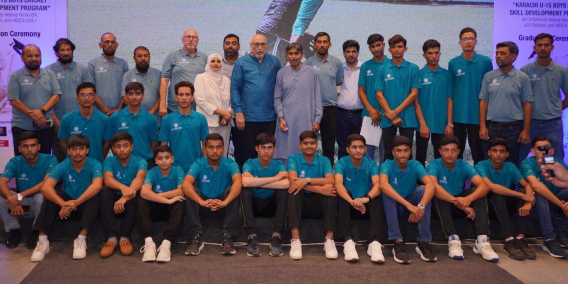 Javed Miandad distributes certificates to participants at the Karachi Under-15 Cricket Skill Development Program graduation ceremony.