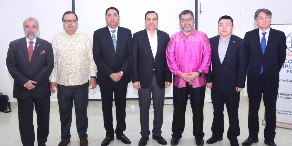 Officials and diplomats attend the Economic Diplomacy Forum's farewell breakfast for the consuls general of Malaysia and Iraq in Karachi.