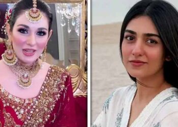 Pakistani actress Sarah Khan wearing a traditional red bridal outfit during a salon photoshoot.