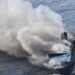Rescue vessels assist passengers after a ferry caught fire at sea in Indonesia.