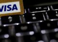 Visa logo alongside cybersecurity graphics representing its acquisition of fraud intelligence company BioCatch.