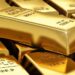 Gold bars and jewellery displayed at a bullion market as gold prices fall in Pakistan.