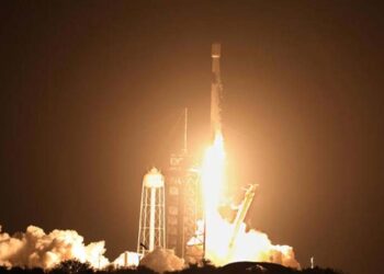 A SpaceX Falcon 9 rocket in flight before its second stage's expected impact on the Moon.