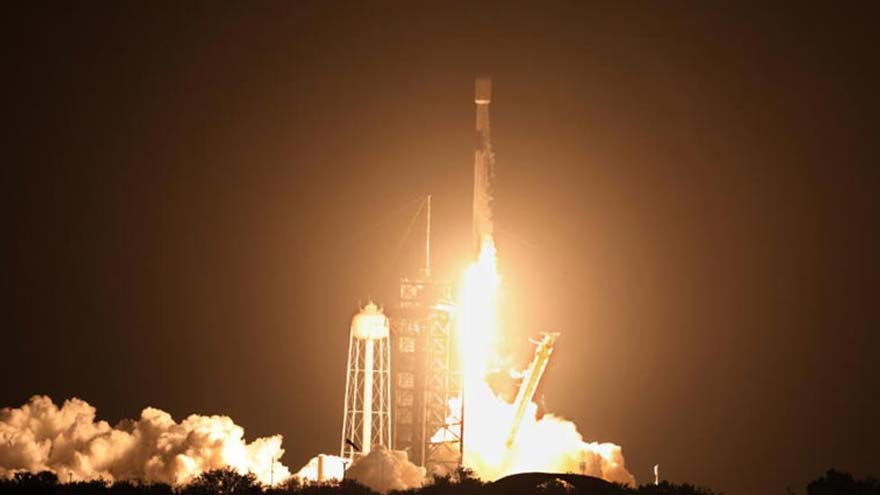 A SpaceX Falcon 9 rocket in flight before its second stage's expected impact on the Moon.