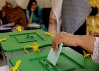 Election staff manage polling arrangements for the Azad Jammu and Kashmir general elections.
