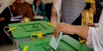 Election staff manage polling arrangements for the Azad Jammu and Kashmir general elections.
