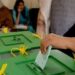 Election staff manage polling arrangements for the Azad Jammu and Kashmir general elections.