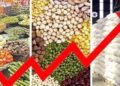 Customers purchasing vegetables and groceries at a market amid rising inflation in Pakistan.