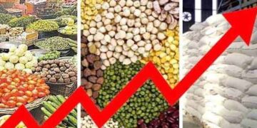 Customers purchasing vegetables and groceries at a market amid rising inflation in Pakistan.