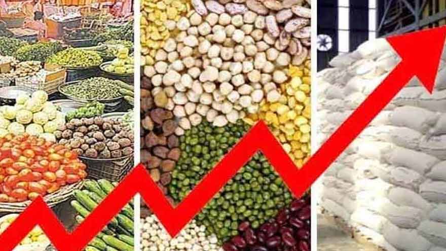Customers purchasing vegetables and groceries at a market amid rising inflation in Pakistan.