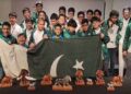 Pakistani young Scrabble players celebrate winning the world team title