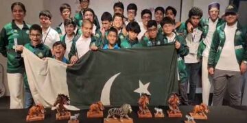 Pakistani young Scrabble players celebrate winning the world team title