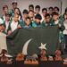 Pakistani young Scrabble players celebrate winning the world team title