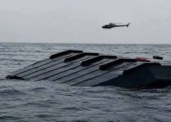 Rescue teams search Lake Kariba after a passenger ferry capsized in Zimbabwe.