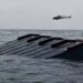 Rescue teams search Lake Kariba after a passenger ferry capsized in Zimbabwe.
