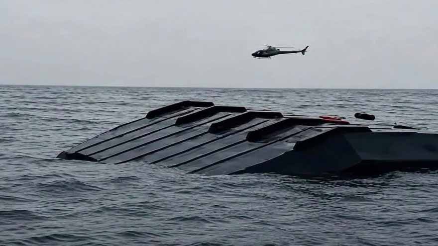 Rescue teams search Lake Kariba after a passenger ferry capsized in Zimbabwe.