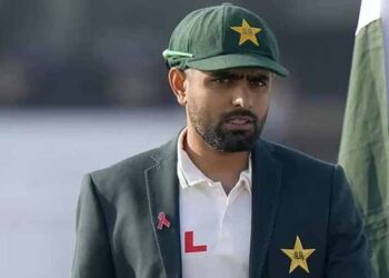Babar Azam holding the Pakistani flag during Independence Day celebrations