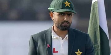 Babar Azam holding the Pakistani flag during Independence Day celebrations