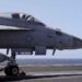 US Navy aircraft carrier during operations as Trump orders changes to shipbuilding policy.