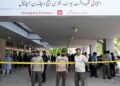 Pakistan Institute of Medical Sciences building amid fire safety concerns after a deadly hospital fire.