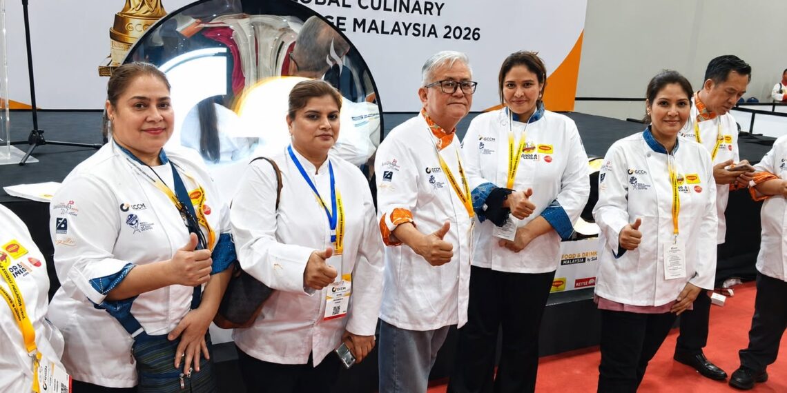 Members of the Karachi Chefs Association at the GCCM Global Culinary Competition in Malaysia after winning medals and diplomas.