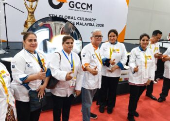 Members of the Karachi Chefs Association at the GCCM Global Culinary Competition in Malaysia after winning medals and diplomas.
