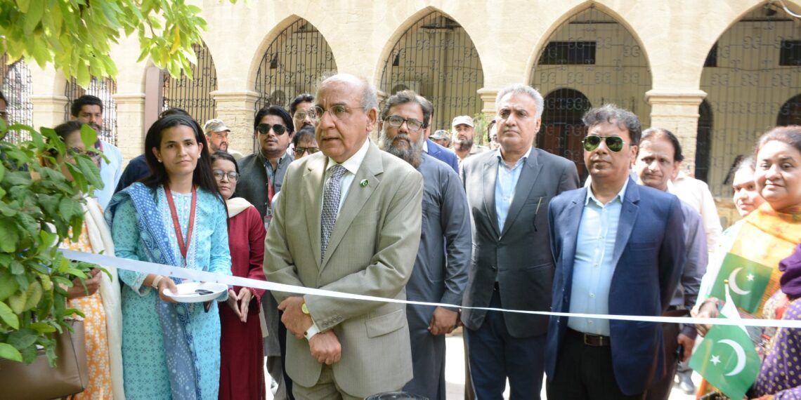 Vice Chancellor Prof. Dr. Mujeeb Sahrai hoists Pakistan's national flag during the 80th Independence Day celebrations at Sindh Madressatul Islam University.