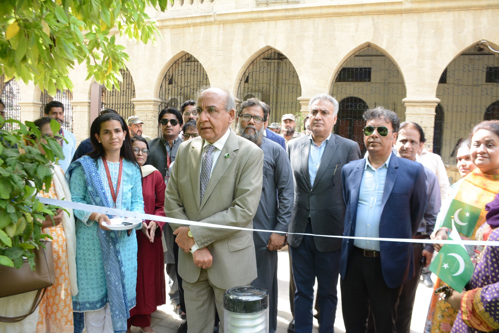 Vice Chancellor Prof. Dr. Mujeeb Sahrai hoists Pakistan's national flag during the 80th Independence Day celebrations at Sindh Madressatul Islam University.