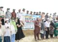 SMIU students and faculty clean Sea View Beach during Independence Day celebrations in Karachi.