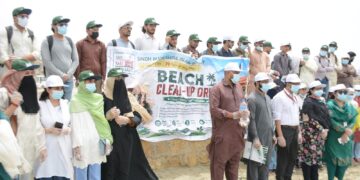 SMIU students and faculty clean Sea View Beach during Independence Day celebrations in Karachi.