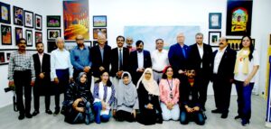 Photographers and artists attend a World Photography Day exhibition at the French Cultural Centre in Karachi