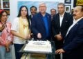 Photographers and artists attend a World Photography Day exhibition at the French Cultural Centre in Karachi