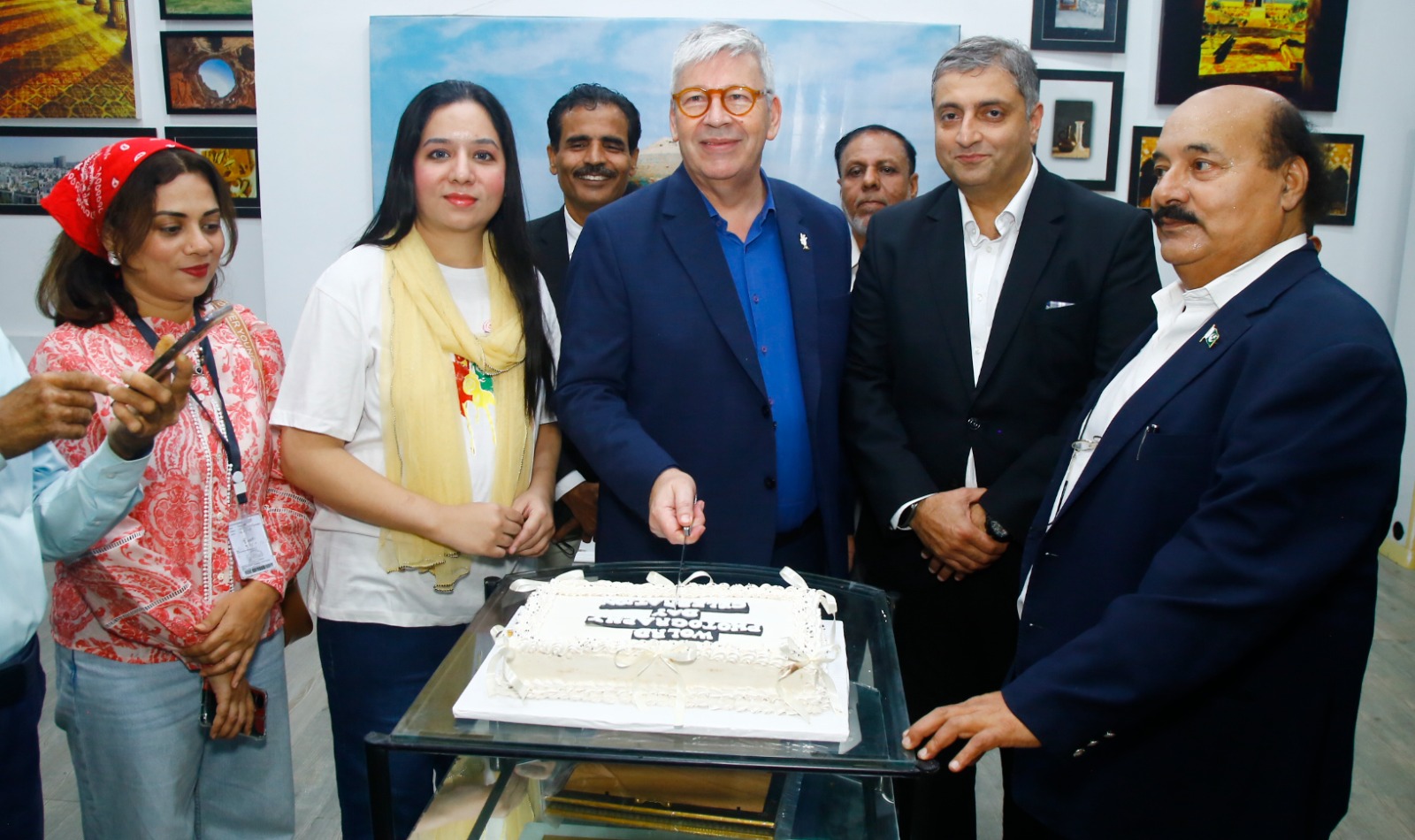 Photographers and artists attend a World Photography Day exhibition at the French Cultural Centre in Karachi