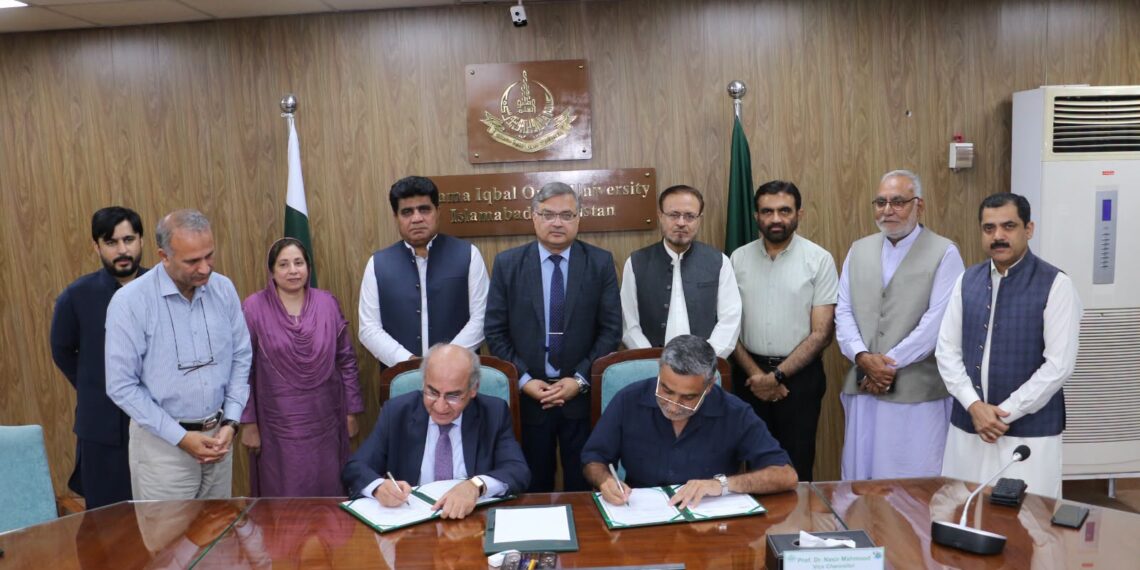 SMIU and AIOU officials during the MoU signing ceremony in Islamabad.