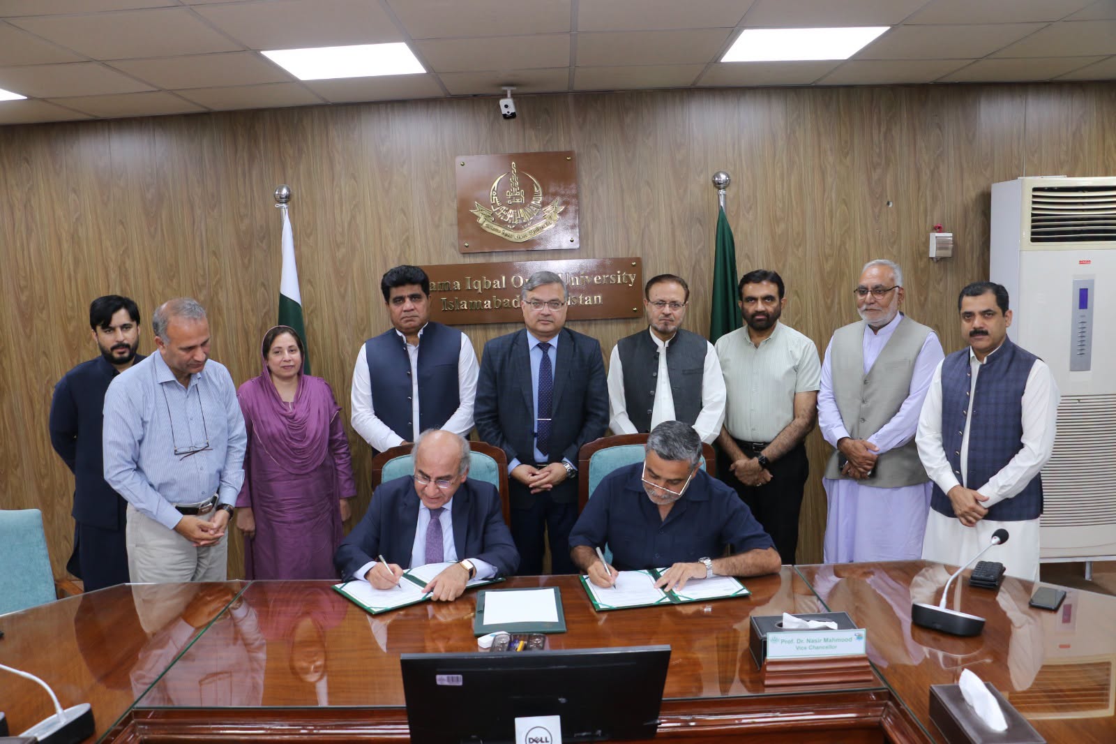 SMIU and AIOU officials during the MoU signing ceremony in Islamabad.