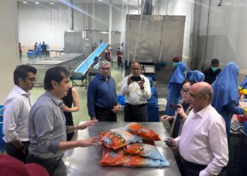 Pakistani seafood products prepared for export to European supermarket markets.