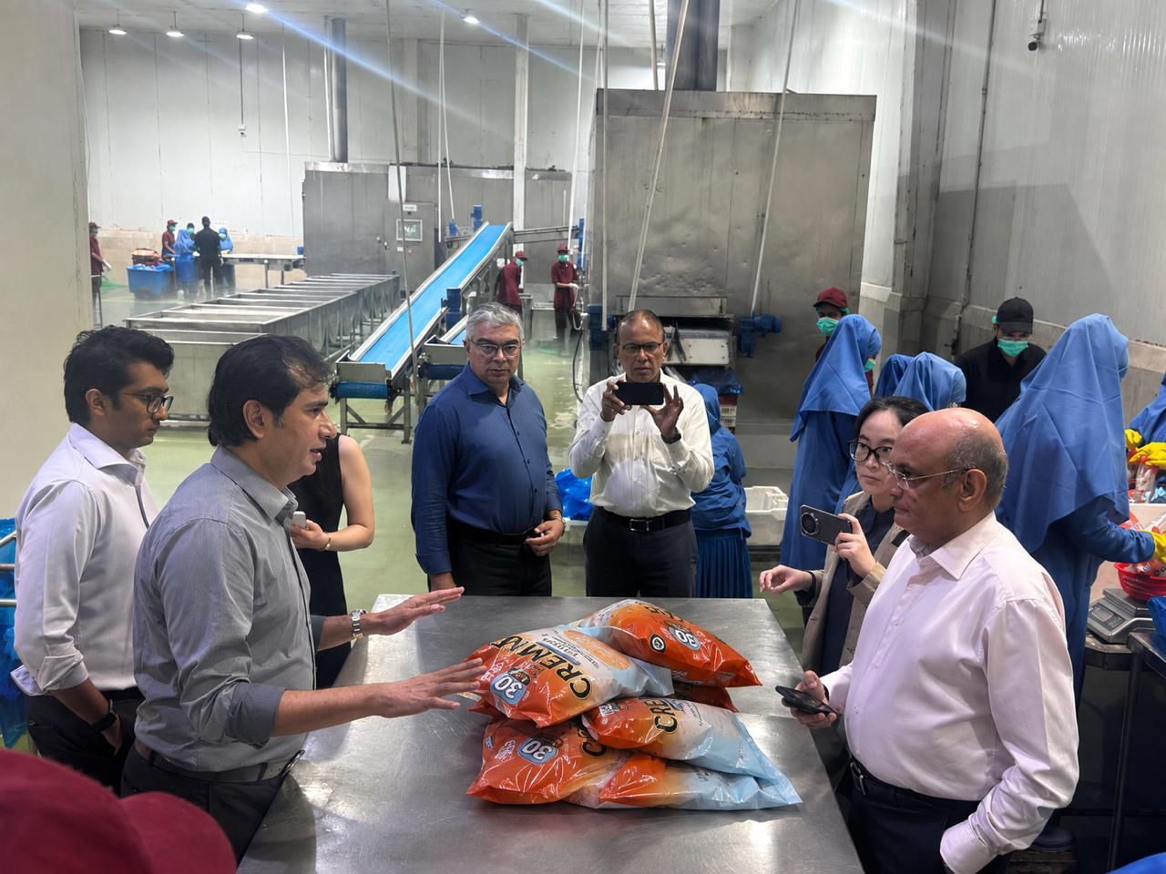 Pakistani seafood products prepared for export to European supermarket markets.