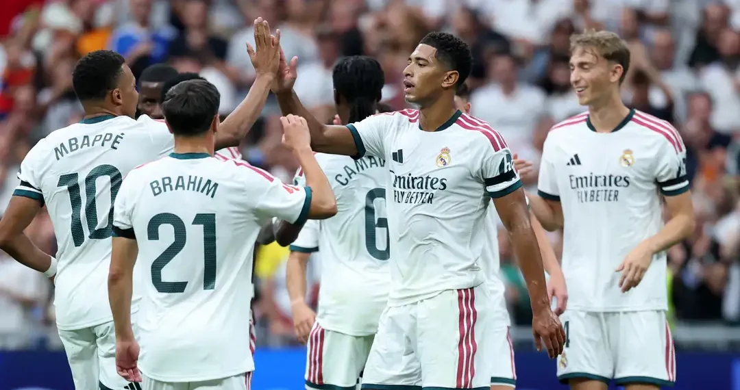 Real Madrid players celebrate during their 4-0 La Liga victory over Malaga at the Santiago Bernabeu.
