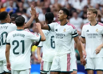 Real Madrid players celebrate during their 4-0 La Liga victory over Malaga at the Santiago Bernabeu.