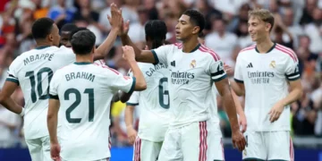 Real Madrid players celebrate during their 4-0 La Liga victory over Malaga at the Santiago Bernabeu.