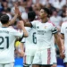 Real Madrid players celebrate during their 4-0 La Liga victory over Malaga at the Santiago Bernabeu.